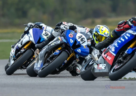 group of motorcycle racers making a turn